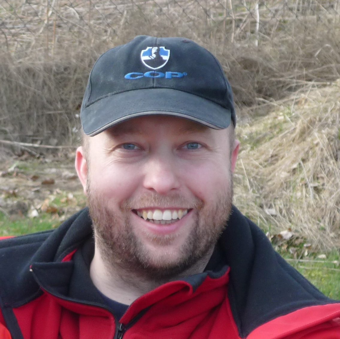 Smiling portrait in a baseball cap